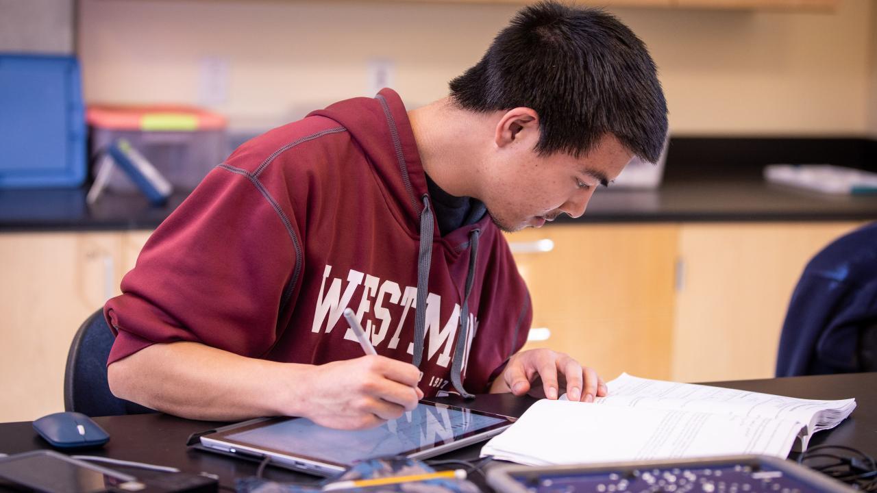 physics student working on assignment